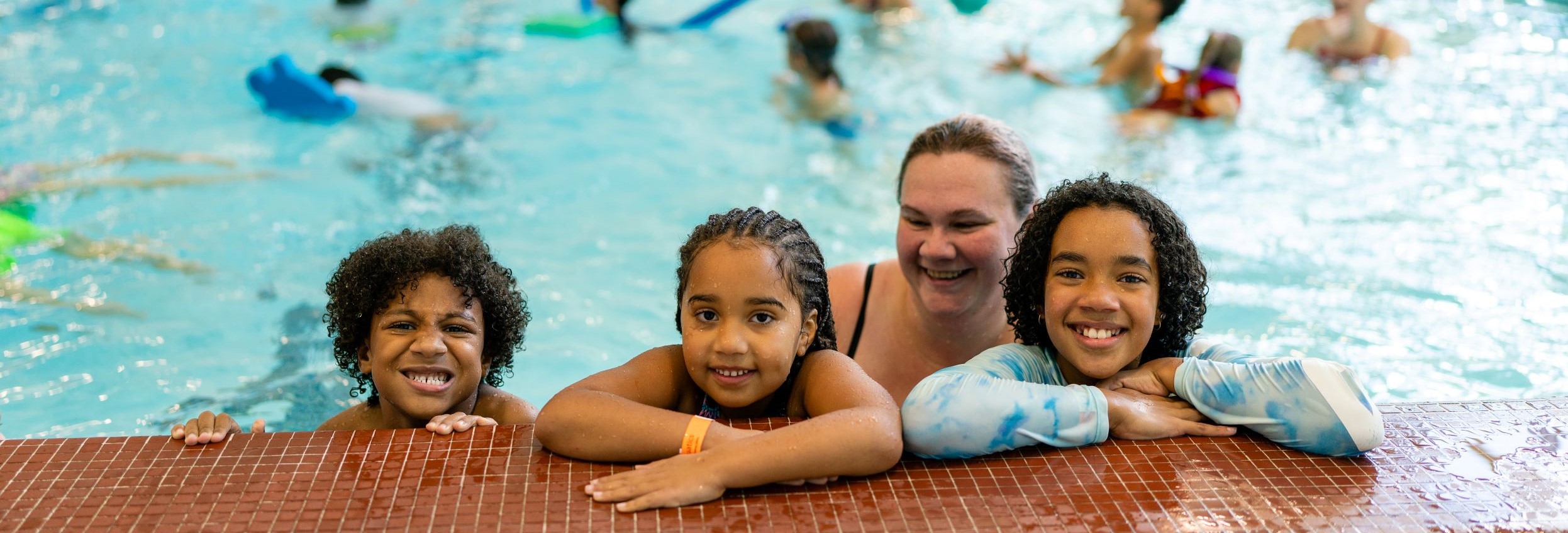 Family participating in aquatic recreation swim session