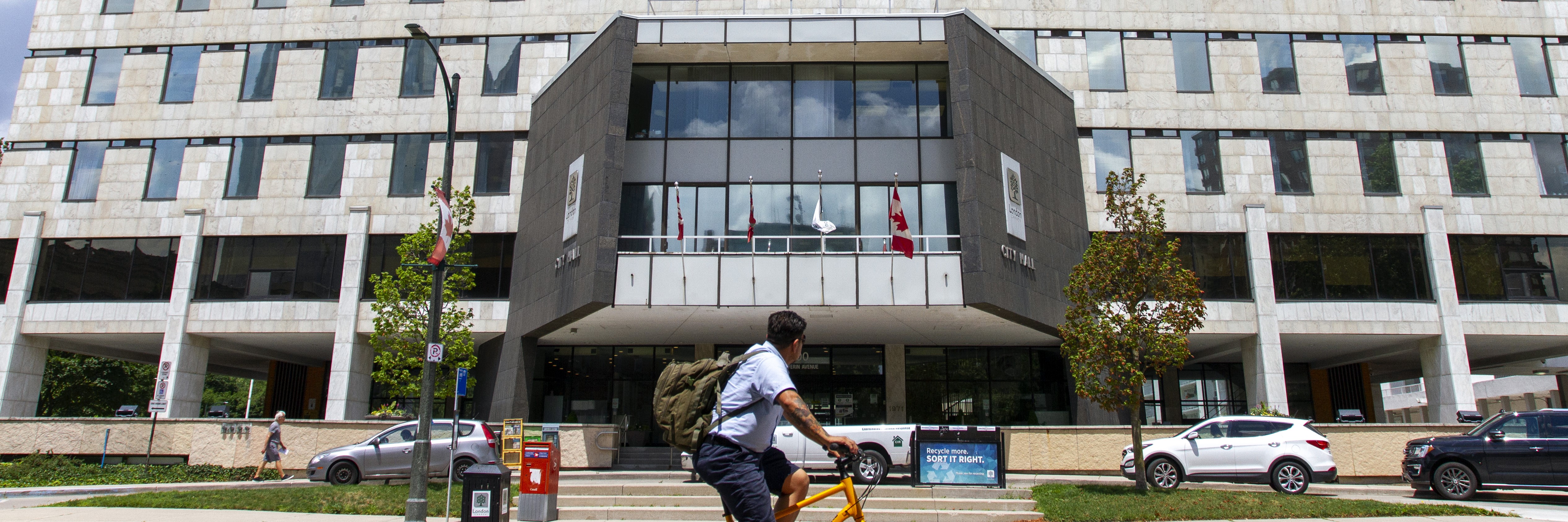 Cyclist riding past City Hall